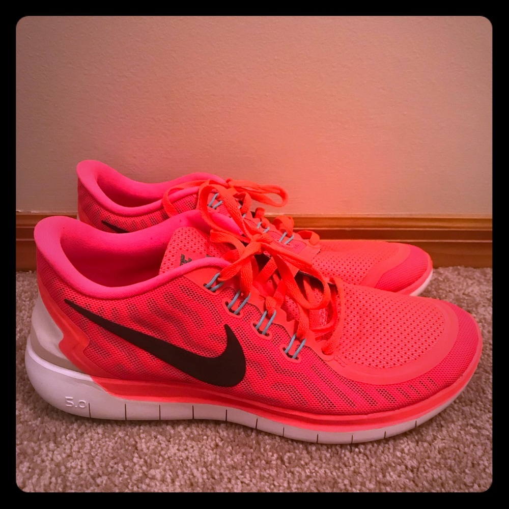 Neon pink nike running shoes